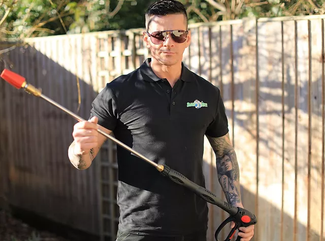 Smartways professional holding jet washing tool outdoors